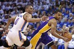 OKLAHOMA CITY, OK - MAY 16:  Ramon Sessions #7 of the Los Angeles Lakers drives inside on Russell Westbrook #0 of the Oklahoma City Thunder in Game Two of the Western Conference Semifinals during the 2012 NBA Playoffs on May 16, 2012 at the Chesapeake Energy Arena in Oklahoma City, Oklahoma. The Thunder beat the Lakers 77-75.  NOTE TO USER: User expressly acknowledges and agrees that, by downloading and or using the photograph, User is consenting to the terms and conditions of the Getty Images License Agreement. (Photo by Brett Deering/Getty Images)