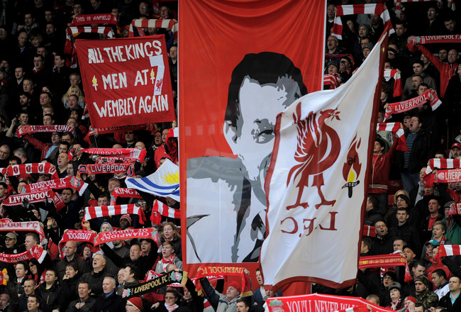 LIVERPOOL, ENGLAND - FEBRUARY 19:  Liverpool fans on the Kop show their support during the FA Cup Fifth Round match between Liverpool and Brighton & Hove Albion at Anfield on February 19, 2012 in Liverpool, England. (Photo by Michael Regan/Getty Images)