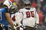 NASHVILLE, TN - NOVEMBER 27:   Albert Haynesworth #95 of the Tampa Bay Buccaneers looks over the offense before a play during a game against the Tennessee Titans at LP Field on November 27, 2011 in Nashville, Tennessee.  The Titans defeated the Buccaneers 23 to 17.  (Photo by Wesley Hitt/Getty Images)