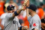 BALTIMORE, MD - MAY 23: Adrian Gonzalez #28 (L) of the Boston Red Sox celebrates with closer Alfredo Aceves #91 after the Red Sox defeated the Baltimore Orioles 6-5at Oriole Park at Camden Yards on May 23, 2012 in Baltimore, Maryland.  (Photo by Rob Carr/Getty Images)