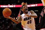 MIAMI, FL - APRIL 19: Udonis Haslem #40 of the Miami Heat shoots over Omer Asik #3 of the Chicago Bulls during a game at American Airlines Arena on April 19, 2012 in Miami, Florida. NOTE TO USER: User expressly acknowledges and agrees that, by downloading and/or using this Photograph, User is consenting to the terms and conditions of the Getty Images License Agreement.  (Photo by Mike Ehrmann/Getty Images)