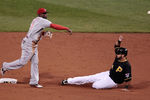 PITTSBURGH, PA - SEPTEMBER 23:  Brandon Phillips #4 of the Cincinnati Reds attempts to turn a double play over Pedro Alvarez #24 of the Pittsburgh Pirates during the game on September 23, 2011 at PNC Park in Pittsburgh, Pennsylvania.  (Photo by Jared Wickerham/Getty Images)