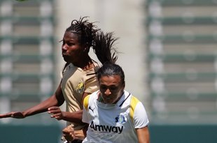 CARSON, CA - APRIL 19:  Kandace Wilson #9 of FC Gold Pride goes up for the header against Marta #10 of the Los Angeles Sol during the WPS match at The Home Depot Center on April 19, 2009 in Carson, California. (Photo by Victor Decolongon/Getty Images)