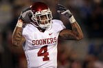 LAWRENCE, KS - OCTOBER 15:  Kenny Stills #4 of the Oklahoma Sooners celebrates after scoring the game's first touchdown against the Kansas Jayhawks during the game on October 15, 2011 at Memorial Stadium in Lawrence, Kansas.  (Photo by Jamie Squire/Getty Images)
