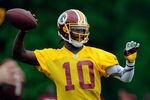 ASHBURN, VA - MAY 06:  Robert Griffin III #10 of the Washington Redskins practices during the Washington Redskins rookie minicamp on May 6, 2012 in Ashburn, Virginia.  (Photo by Patrick McDermott/Getty Images)