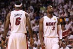 MIAMI, FL - JUNE 12:  Dwyane Wade #3 (R) and LeBron James #6 of the Miami Heat stand on court against the Dallas Mavericks in Game Six of the 2011 NBA Finals at American Airlines Arena on June 12, 2011 in Miami, Florida. NOTE TO USER: User expressly acknowledges and agrees that, by downloading and/or using this Photograph, user is consenting to the terms and conditions of the Getty Images License Agreement.  (Photo by Mike Ehrmann/Getty Images)