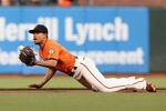 SAN FRANCISCO, CA - MAY 04:  Emmanuel Burriss #2 of the San Francisco Giants flips the ball from his glove to get Rickie Weeks #23 of the Milwaukee Brewers out at second base in the first inning at AT&T Park on May 4, 2012 in San Francisco, California.  (Photo by Ezra Shaw/Getty Images)