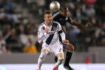CARSON, CA - MAY 23:  David Beckham #23 of the Los Angeles Galaxy and Justin Morrow #15 of the San Jose Earthquakes vie for a high ball during the MLS match at The Home Depot Center on May 23, 2012 in Carson, California. The Earthquakes defeated the Galaxy 3-2.  (Photo by Victor Decolongon/Getty Images)