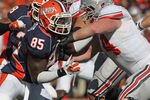 CHAMPAIGN, IL - OCTOBER 15: Whitney Mercilus #85 of the Illinois Fighting Illini rushes against Jack Mewhort #74 of the Ohio State Buckeyes at Memorial Stadium on October 15, 2011 in Champaign, Illinois. Ohio State defeated Illinois 17-7. (Photo by Jonathan Daniel/Getty Images)