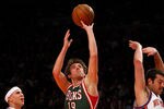 NEW YORK, NY - MARCH 26:  Beno Udrih #19 of the Milwaukee Bucks drives for a shot attempt against Mike Bibby #20 and Josh Harrellson #55 of the New York Knicks at Madison Square Garden on March 26, 2012 in New York City. NOTE TO USER: User expressly acknowledges and agrees that, by downloading and or using this photograph, User is consenting to the terms and conditions of the Getty Images License Agreement.  (Photo by Chris Chambers/Getty Images)