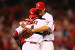 ST. LOUIS, MO - MAY 22: Starter Adam Wainwright #50 of the St. Louis Cardinals is congratulated by Yadier Molina #4 also of the St. Louis Cardinals after throwing a complete-game shut out against the San Diego Padres at Busch Stadium on May 22, 2012 in St. Louis, Missouri.  (Photo by Dilip Vishwanat/Getty Images)