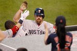 BALTIMORE, MD - MAY 22:  Kevin Youkilis #20 of the Boston Red Sox celebrates with teammates after hitting a solo home run during the fourth inning against the Baltimore Orioles at Oriole Park at Camden Yards on May 22, 2012 in Baltimore, Maryland.  (Photo by Rob Carr/Getty Images)