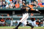 BALTIMORE, MD - MAY 11:  Adam Jones #10 of the Baltimore Orioles hits a home run in the second inning against the Tampa Bay Rays at Oriole Park at Camden Yards on May 11, 2012 in Baltimore, Maryland.  (Photo by Greg Fiume/Getty Images)