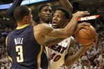 MIAMI, FL - MAY 13: Forward Udonis Haslem #40 of the Miami Heat is defended by Guard George Hill #3 and Center Roy Hibbert #55 of the Indiana Pacers in Game One of the Eastern Conference Semifinals in the 2012 NBA Playoffs on May 13, 2012 at the American Airines Arena in Miami, Florida. NOTE TO USER: User expressly acknowledges and agrees that, by downloading and or using this photograph, User is consenting to the terms and conditions of the Getty Images License Agreement.  (Photo by Marc Serota/Getty Images)