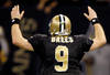 NEW ORLEANS, LA - JANUARY 07:   Drew Brees #9 of the New Orleans Saints celebrates after throwing a touchdown pass to Robert Meachem #17 in the fourth quarter against the Detroit Lions during their 2012 NFC Wild Card Playoff game at Mercedes-Benz Superdome on January 7, 2012 in New Orleans, Louisiana.  (Photo by Chris Graythen/Getty Images)