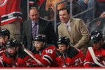 NEWARK, NJ - MAY 06: (l-r) Head coach Peter DeBoer and assistant coach Adam Oates of the New Jersey Devils handle bench duties against the Philadelphia Flyers in Game Four of the Eastern Conference Semifinals during the 2012 NHL Stanley Cup Playoffs at Prudential Center on May 6, 2012 in Newark, New Jersey. The Devils defeated the Flyers 4-2.  (Photo by Bruce Bennett/Getty Images)
