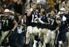 HOUSTON, TX - FEBRUARY 1:  Quarterback Tom Brady #12 of the New England Patriots celebartes after teammate Adam Vinatieri #4 kicked the game winning field goal in the fourth quarter against the Carolina Panthers during Super Bowl XXXVIII at Reliant Stadium on February 1, 2004 in Houston, Texas. The Patriots won 32-29. (Photo by Elsa/Getty Images)