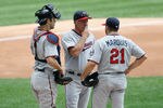 MILWAUKEE, WI - MAY 20:  Rick Anderson #40 of the Minnesota Twins talks with Jason Marquis #21 and Joe Mauer #7 during the game against the Milwaukee Brewers during interleague play at Miller Park on May 20, 2012 in Milwaukee, Wisconsin. (Photo by Scott Boehm/Getty Images)