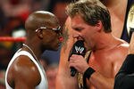 LAS VEGAS - AUGUST 24:  Boxer Floyd Mayweather Jr. (L) stares down wrestler Chris Jericho during the WWE Monday Night Raw show at the Thomas & Mack Center August 24, 2009 in Las Vegas, Nevada. Mayweather was a special guest host during the broadcast.  (Photo by Ethan Miller/Getty Images)