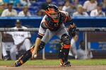 MIAMI, FL - MAY 24:  Buster Posey #28 of the San Francisco Giants makes a throw to second during a game against the Miami Marlins at Marlins Park on May 24, 2012 in Miami, Florida.  (Photo by Mike Ehrmann/Getty Images)