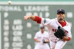 BOSTON, MA - MAY 15:  Josh Beckett #19 of the Boston Red Sox delivers a pitch in the first inning against the Seattle Mariners on May 15, 2012 at Fenway Park in Boston, Massachusetts.  (Photo by Elsa/Getty Images)