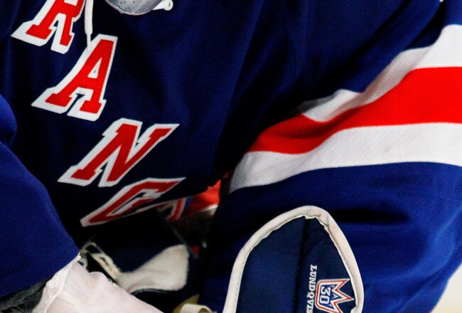 NEW YORK, NY - MAY 23:  Henrik Lundqvist #30 of the New York Rangers adjusts his glove against the New Jersey Devils in Game Five of the Eastern Conference Final during the 2012 NHL Stanley Cup Playoffs at Madison Square Garden on May 23, 2012 in New York City.  (Photo by Bruce Bennett/Getty Images)