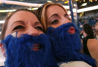 TAMPA, FL - APRIL 18: Tampa Bay Lightning fans wearing blue beards lend their support for their team against the Pittsburgh Penguins in Game Three of the Eastern Conference Quarterfinals during the 2011 NHL Stanley Cup Playoffs at the St. Pete Times Forum on April 18, 2011 in Tampa, Florida. (Photo by Eliot J. Schechter/Getty Images)