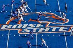 BOISE, ID - OCTOBER 01:  Kellen Moore #11 of the Boise State Broncos (left) passes against the Nevada Wolf Pack at Bronco Stadium on October 1, 2011 in Boise, Idaho.  (Photo by Otto Kitsinger III/Getty Images)
