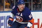 UNIONDALE, NY - FEBRUARY 24:  John Tavares #91 of the New York Islanders skates against the New York Rangers at the Nassau Veterans Memorial Coliseum on February 24, 2012 in Uniondale, New York. The Islanders defeated the Rangers 4-3 in the shootout.  (Photo by Bruce Bennett/Getty Images)