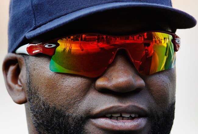BALTIMORE, MD - MAY 22: David Ortiz #34 of the Boston Red Sox talks with a teammate while waiting to take batting practice before the start of the Red Sox and Baltimore Orioles game at Oriole Park at Camden Yards on May 22, 2012 in Baltimore, Maryland.  (Photo by Rob Carr/Getty Images)