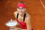 ROME, ITALY - MAY 20:  Maria Sharapova of Russia celebrates with the trophy after defeating Na Li of China during their final match during day nine of the Internazionali BNL d'Italia 2012 at the Foro Italico Tennis Centre on May 20, 2012 in Rome, Italy.  (Photo by Julian Finney/Getty Images)