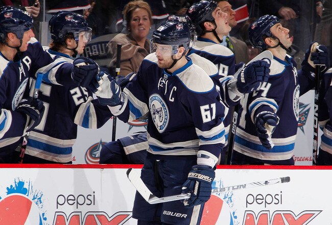 COLUMBUS, OH - JANUARY 14:  Rick Nash #61 of the Columbus Blue Jackets celebrates a third period goal with teammates while playing the San Jose Sharks at Nationwide Arena on January 14, 2012 in Columbus, Ohio. The San Jose Sharks won the game 2-1. (Photo by Gregory Shamus/Getty Images)