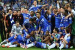 MUNICH, GERMANY - MAY 19:  Chelsea players celebrate with the trophy after their victory in the UEFA Champions League Final between FC Bayern Muenchen and Chelsea at the Fussball Arena München on May 19, 2012 in Munich, Germany.  (Photo by Alex Livesey/Getty Images)