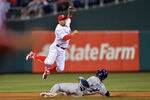 PHILADELPHIA, PA - MAY 11: Freddy Galvis #13 of the Philadelphia Phillies jumps over Orlando Hudson #1 of the San Diego Padres after putting him out at second base on a double play at Citizens Bank Park on May 11, 2012 in Philadelphia, Pennsylvania. The Phillies won 7-3. (Photo by Drew Hallowell/Getty Images)