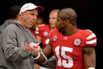 LINCOLN, NE - NOVEMBER 25: Cornerback Alfonzo Dennard #15 of the Nebraska Cornhuskers is greeted by Head Coach Bo Pelini on senior day before playing a  game against the Iowa Hawkeyes at Memorial Stadium November 25, 2011 in Lincoln, Nebraska. Nebraska defeated Iowa 20-7. (Photo by Eric Francis/Getty Images)