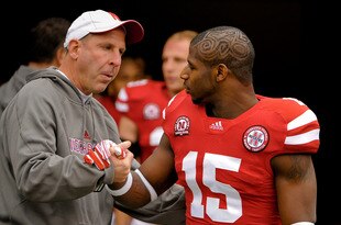LINCOLN, NE - NOVEMBER 25: Cornerback Alfonzo Dennard #15 of the Nebraska Cornhuskers is greeted by Head Coach Bo Pelini on senior day before playing a  game against the Iowa Hawkeyes at Memorial Stadium November 25, 2011 in Lincoln, Nebraska. Nebraska defeated Iowa 20-7. (Photo by Eric Francis/Getty Images)