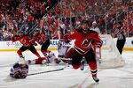NEWARK, NJ - MAY 25:  Adam Henrique #14 of the New Jersey Devils celerbates after scoring the game winning goal in overtime against Henrik Lundqvist #30 of the New York Rangers to win Game Six of the Eastern Conference Final and advance to the 2012 NHL Stanley Cup Final at the Prudential Center on May 25, 2012 in Newark, New Jersey.  (Photo by Bruce Bennett/Getty Images)