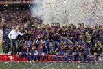 MADRID, SPAIN - MAY 25:  Players of Barcelona poses with the trophy in celebration after their victory in the Copa del Rey Final match between Athletic Bilbao and Barcelona at Vicente Calderon Stadium on May 25, 2012 in Madrid, Spain.  (Photo by Angel Martinez/Getty Images)