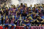 MADRID, SPAIN - MAY 25: Players of Barcelona pose with the trophy in celebration after their victory in the Copa del Rey Final match between Athletic Bilbao and Barcelona at Vicente Calderon Stadium on May 25, 2012 in Madrid, Spain. (Photo by Angel Martinez/Getty Images)