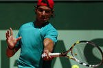 PARIS, FRANCE - MAY 26:  Rafael Nadal of Spain plys a forehand during a practice session ahead of the 2012 French Open at Roland Garros on May 26, 2012 in Paris, France.  (Photo by Dan Istitene/Getty Images)