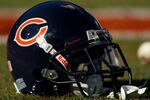 DENVER, CO - DECEMBER 11:  A Chicago Bears helmet sits on the grass before a game against the Denver Broncos at Sports Authority Field at Mile High on December 11, 2011 in Denver, Colorado. (Photo by Justin Edmonds/Getty Images)
