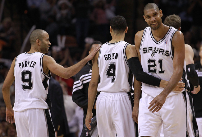 SAN ANTONIO, TX - MAY 17:  (L-R) Tony Parker #9, Daniel Green #4 and Tim Duncan #21 of the San Antonio Spurs celebrate during play against the Los Angeles Clippers in Game Two of the Western Conference Semifinals of the 2012 NBA Playoffs at AT&T Center on May 17, 2012 in San Antonio, Texas.  NOTE TO USER: User expressly acknowledges and agrees that, by downloading and or using this photograph, User is consenting to the terms and conditions of the Getty Images License Agreement.  (Photo by Ronald Martinez/Getty Images)