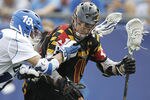 FOXBORO, MA - MAY 26:  Tommy Patterson #18 of the Duke Blue Devils gets his stick in the face of Joe Cummings #19 of the Maryland Terripans during the first half of a semifinal game of the 2012 NCAA Division I Men's Lacrosse Championships  at Gillette Stadium on May 26, 2012 in Foxboro, Massachusetts.  (Photo by Winslow Townson/Getty Images)
