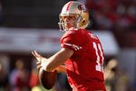 SAN FRANCISCO, CA - JANUARY 14:  Alex Smith #11 of the San Francisco 49ers looks to pass from the pocket during the NFC Divisional playoff game against the New Orleans Saints at Candlestick Park on January 14, 2012 in San Francisco, California.  (Photo by Ezra Shaw/Getty Images)