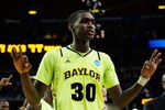 ATLANTA, GA - MARCH 23:  Quincy Miller #30 of the Baylor Bears cleebrates during their 75 to 70 win over the Xavier Musketeers during the 2012 NCAA Men's Basketball South Regional Semifinal game at the Georgia Dome on March 23, 2012 in Atlanta, Georgia.  (Photo by Kevin C. Cox/Getty Images)