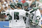 FOXBORO, MA - MAY 26:  Eric Lusby #12 of Loyola Greyhounds (C) is congratulated by teammates after scoring against the Notre Dame Fighting Irish during the first half of a semifinal game of the 2012 NCAA Division I Men's Lacrosse Championships at Gillette Stadium on May 26, 2012 in Foxboro, Massachusetts.  (Photo by Winslow Townson/Getty Images)