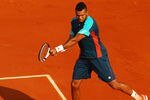 PARIS, FRANCE - MAY 27:  Jo-Wilfried Tsonga of France plays a backhand during the men's singles first round match between Andrey Kuznetsov of Russia and Jo-Wilfried Tsonga of France on day one of the French Open at Roland Garros on May 27, 2012 in Paris, France.  (Photo by Clive Brunskill/Getty Images)