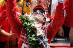 INDIANAPOLIS, IN - MAY 27:  Dario Franchitti of Scotland, driver of the #50 Target Chip Ganassi Racing Honda, points in the air as he holds the victory milk over his head in victory lane in celebration of winning the IZOD IndyCar Series 96th running of the Indianapolis 500 mile race at the Indianapolis Motor Speedway on May 27, 2012 in Indianapolis, Indiana.  (Photo by Jonathan Ferrey/Getty Images)