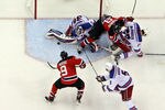 NEWARK, NJ - MAY 25:  Henrik Lundqvist #30 of the New York Rangers makes a save Zach Parise #9 of the New Jersey Devils in Game Six of the Eastern Conference Final during the 2012 NHL Stanley Cup Playoffs at the Prudential Center on May 25, 2012 in Newark, New Jersey.  (Photo by Jim McIsaac/Getty Images)