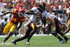 LOS ANGELES, CA - SEPTEMBER 03:  Quarterback MarQueis Gray #5 of the Minnesota Golden Gophers rolls out with the ball against the USC Trojans at the Los Angeles Memorial Coliseum on September 3, 2011 in Los Angeles, California. USC won 19-17.  (Photo by Stephen Dunn/Getty Images)